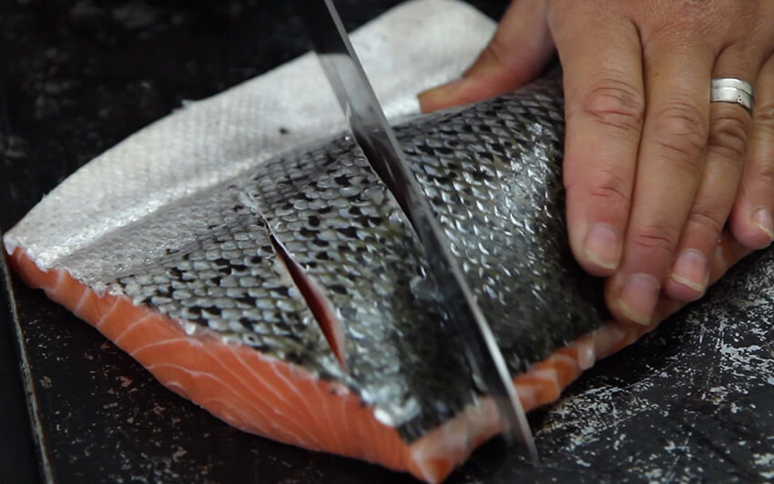 Slice the skin of the salmon before marinating - Gen Taylor Video Recipe