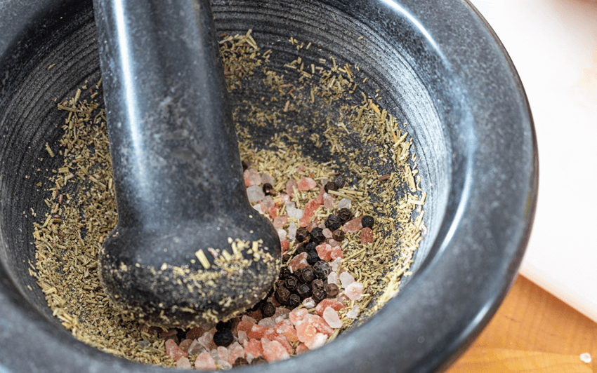 Grind together the spices for this recipe