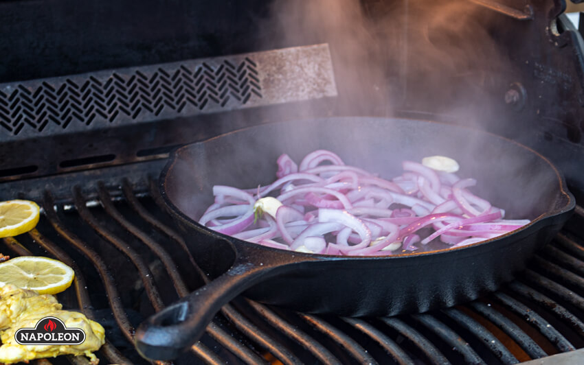While the chicken is grilling, cook the onion and garlic