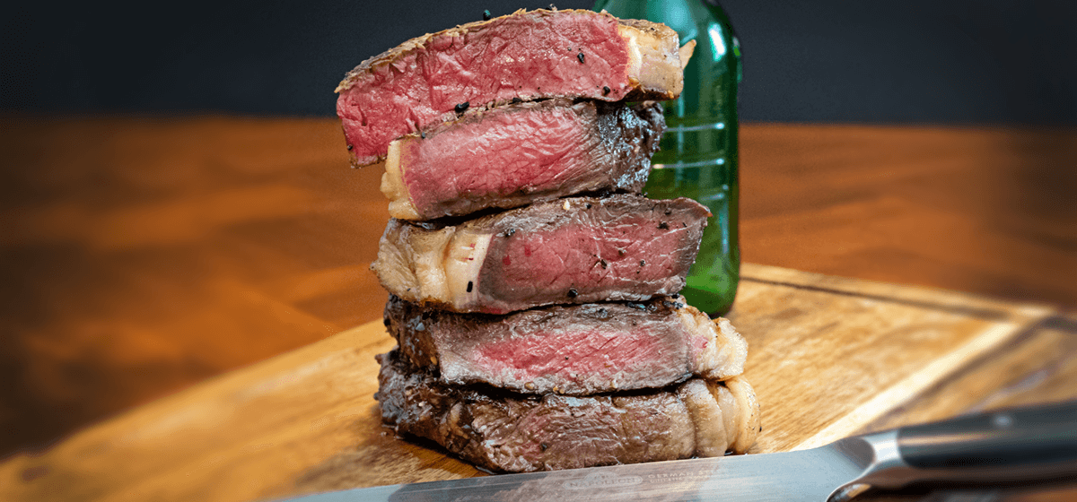 https://www.napoleon.com/sites/default/files/styles/large_banner_image_1200_by_560_/public/images/2019-04/recipeBlog-feature-howToCookSteakSizzleZone-24may19.png?h=bde28bee&itok=5gkUSnoy